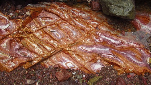 Photo of Liesegang rings in Rhyolite (KofA Mountains, SW Arizona) — from the linked Wikipedia page. Photo license: CC0
