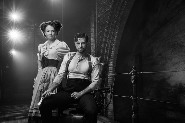 Sutton Foster and Aaron Tveit in character as Mrs. Lovett and Sweeney Todd in a black and white publicity photo for "Sweeney Todd" on Broadway